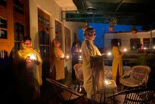 people lighten up candles in paunta