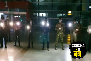 Employees and CISF personnel lit candles at Delhi Airport