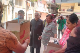 aap mla girish soni distribute food to needy shivaji bhagat colony in delhi