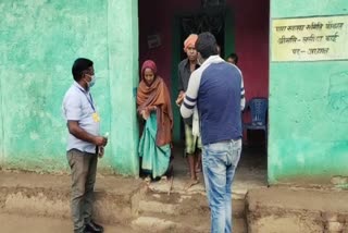 Tribal youth distributing grocery items