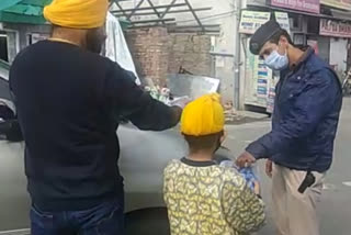 distributing tea and biscuits to policemen