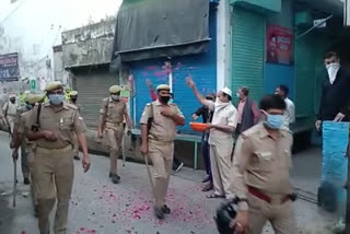 flowers showered on policemen in muslim colonies of amroha uttar pradesh