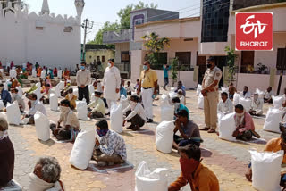 babajani durrani distributes food grain packets to needy people