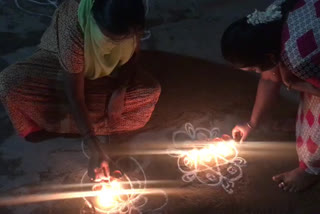 thiruvannamalai district women lighting the lamp in fornt of their house for  Rumors