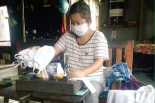 Aanganwadi workers stitching protective masks in Mizoram