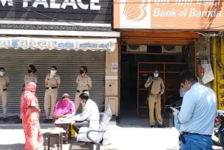 Token system implemented to maintain social distance outside banks in Yamunanagar