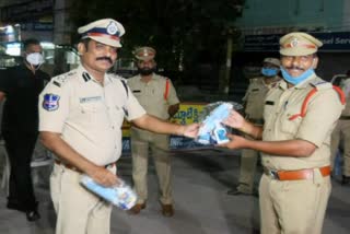 Ramagundam CP Satyanarayana distributed masks and sanitizers to the police