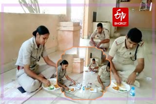 policemen-eating-food-sitting-on-the-floor-of-temple-in-bilaspur