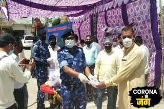 bhaaratiya jan seva trust and RAF 103 Battalion distributed sanitizer kits in Shiv Vihar