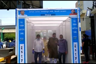 sanitizer gate installed at azadpur mandi in delhi by minister gopal rai