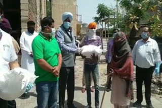 Packets of ration prepared by the Punjab government were distributed to needy families