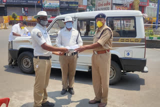 Distributing caps to the police for protection of  sun light in visakhapatnam