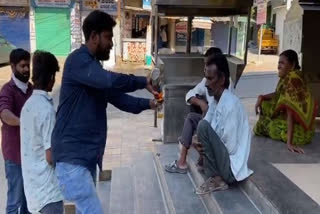 Hyderabad man distributes alcohol pegs