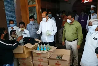 Distribution of sanitizers and masks for sanitation workers