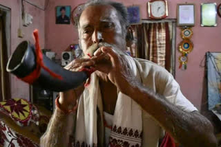 people celebrating bihu in assam along with their family