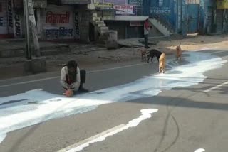 milk spill over road in agra