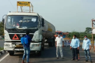 Chemical spray on vehicle at purushottapuram check post