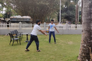 Minister C.T. Ravi playing volleyball with  kids