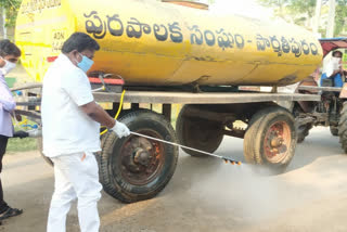 mla sprayng hcl liquid at parvathipuram in vijayanagaram