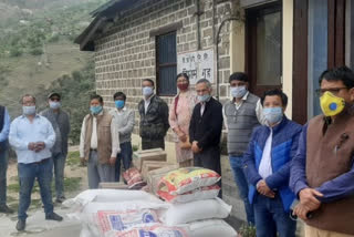 Kinnaur Welfare Committee Jury distributing ration in rampur