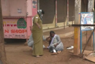 unconscious to the woman standing in the front row of the bank