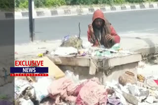 Panipat  person eating food from the garbage