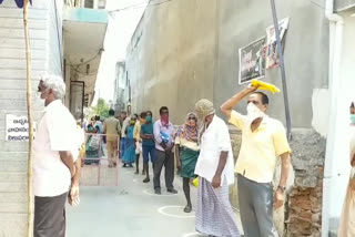 Beneficiaries of physical distance in front of the Andhra Bank in rajam