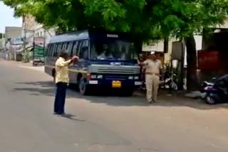 A man tries to throw the stone to police at Vijayapura