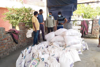 rrestler yogeshwar dutt delivering dry ration to needy people