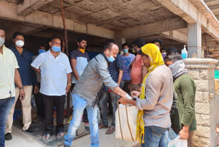 film producer SN Reddy delivering essential supplies to migrant workers in KukatPalli