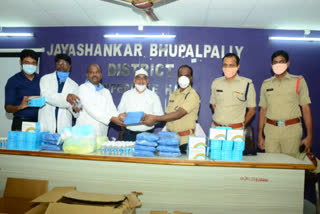 ima distributed sanitizers and masks immunity booster medicines to bhupalpally police