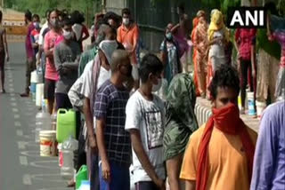 Residents of Delhi's Chilla village wait for hours to collect water from DJB tankers