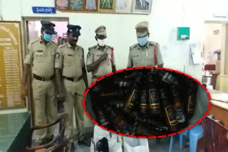 Police seized illicit liquor at gudivada bus stand in krishna district