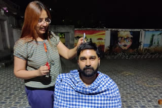 Dumka DC trims hair of husband