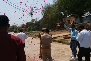 administration is welcomed by people with flowers