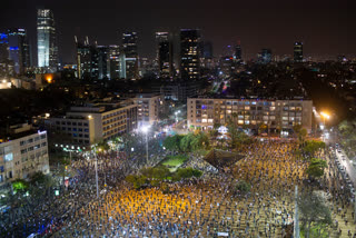 People keep social distancing amid concerns over the country's coronavirus outbreak, during a protest against Prime Minister Benjamin Netanyahu in Tel Aviv, Israel, on Sunday.