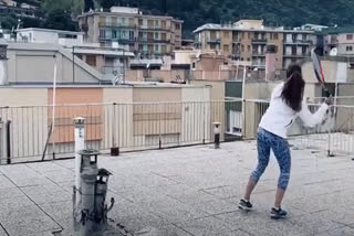 Two Italy women play rooftop tennis