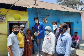 Press club members distributed Sanitizer bottle to poor women