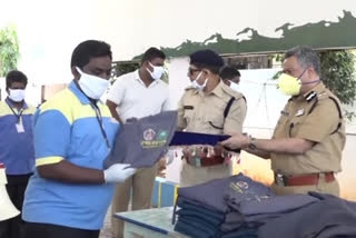 vijayawada cp distributes ppe kits for petrol bunk workers