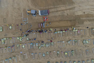 Dozens of coffins arrive at Brazil mass grave