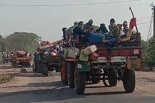 other state labours travel from tractor in akot