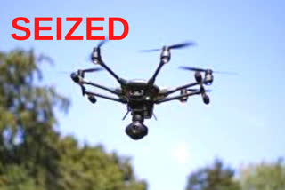 Drone hovering over security