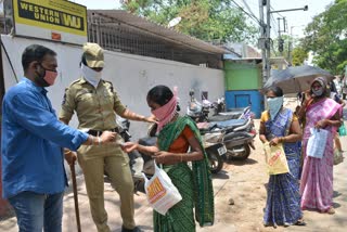 Officers distributing cash to the public through token