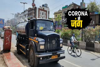 Spraying sanitation in North MCD Paharganj area during the corona