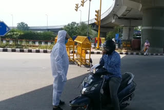 police personal wearing ppe kit during lockdown checking in geeta colony