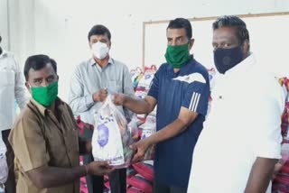 dmk party members distribute relief items for covai auto drivers