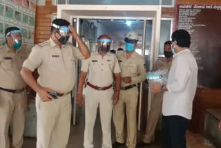 distribution of face shield mask to police staff at hubli