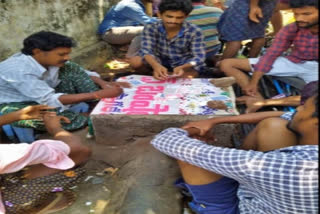 youth are playing cards in water tank in gunadala