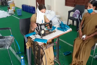 Female policeman is making masks with duty