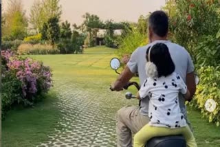 sakshi-shares-video-of-dhoni-giving-ziva-a-bike-ride-at-home